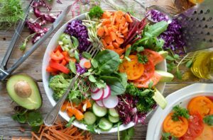 Plate of colourful vegan food and colourful salad