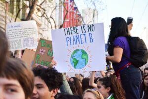 Marching to support going vegan for the environment - a sign reading there is only one planet