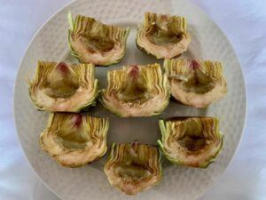 Plate of prepared artichokes, ready for cooking