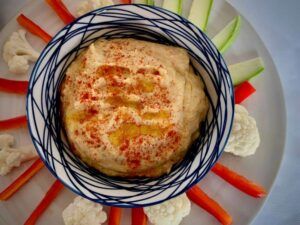 Bowl of hummus with crudités