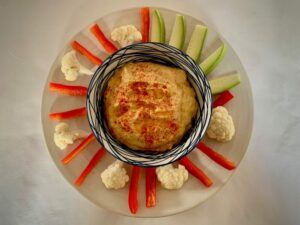 Bowl of hummus with crudités