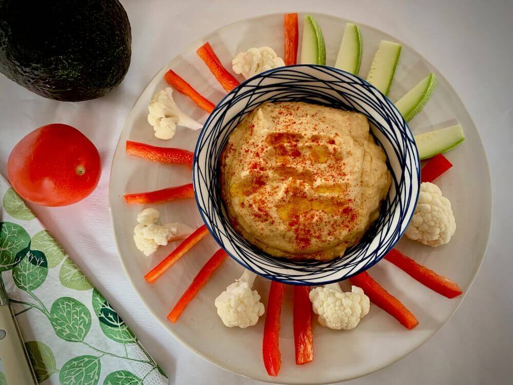 Bowl of hummus with crudités