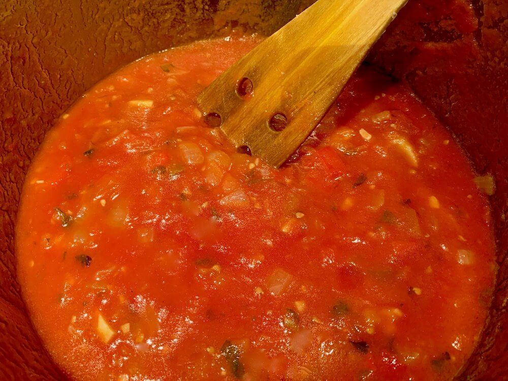 Saucepan with tomato sauce