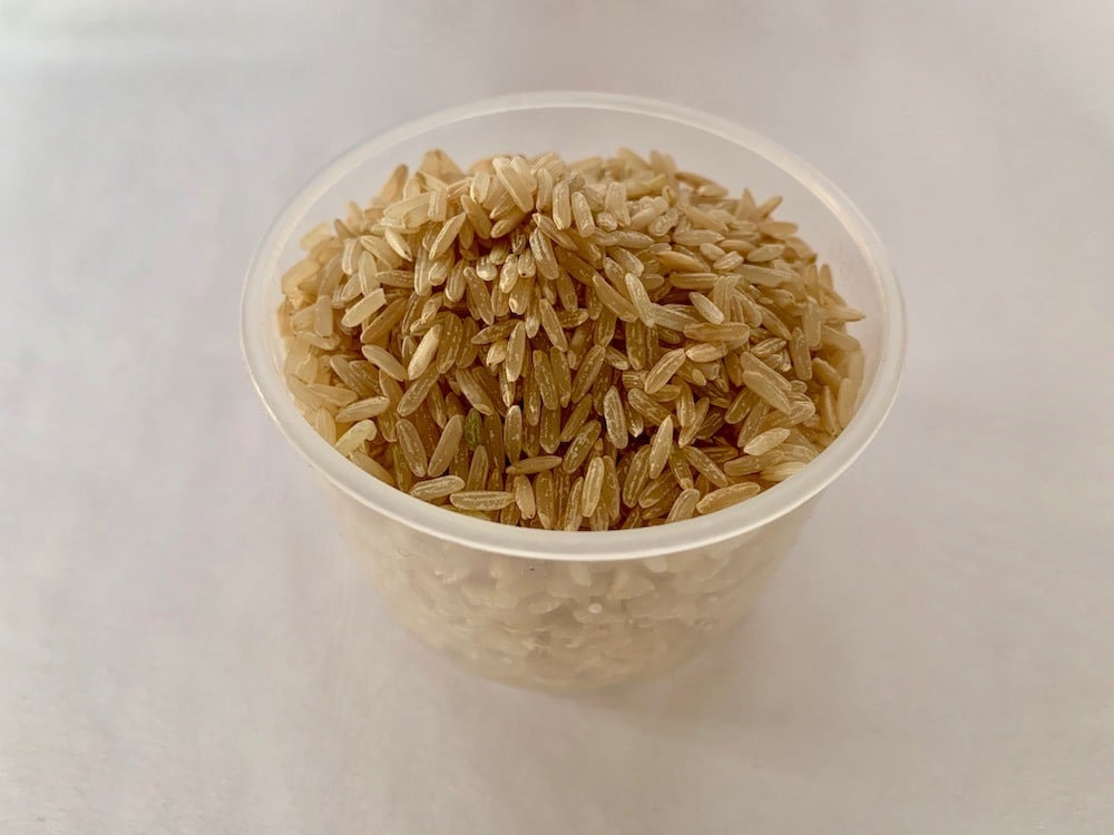 Measuring cup of rice