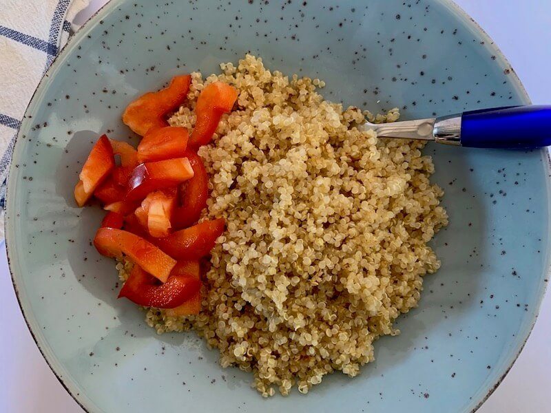 Bowl of quinoa with sliced red pepper