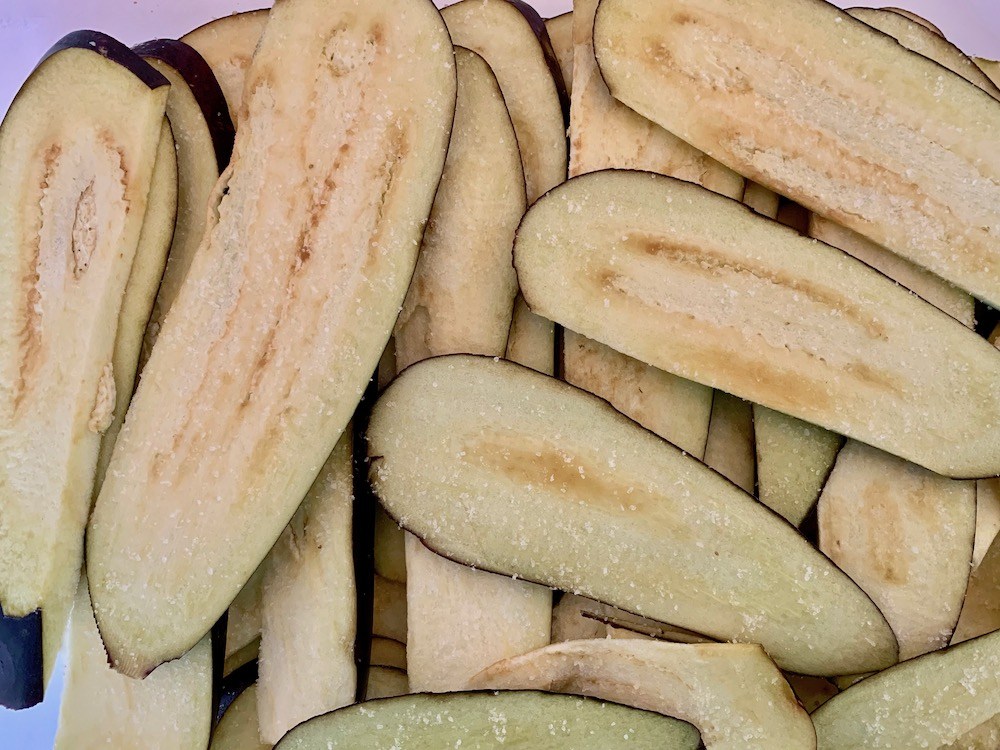 Slices of salted eggplant