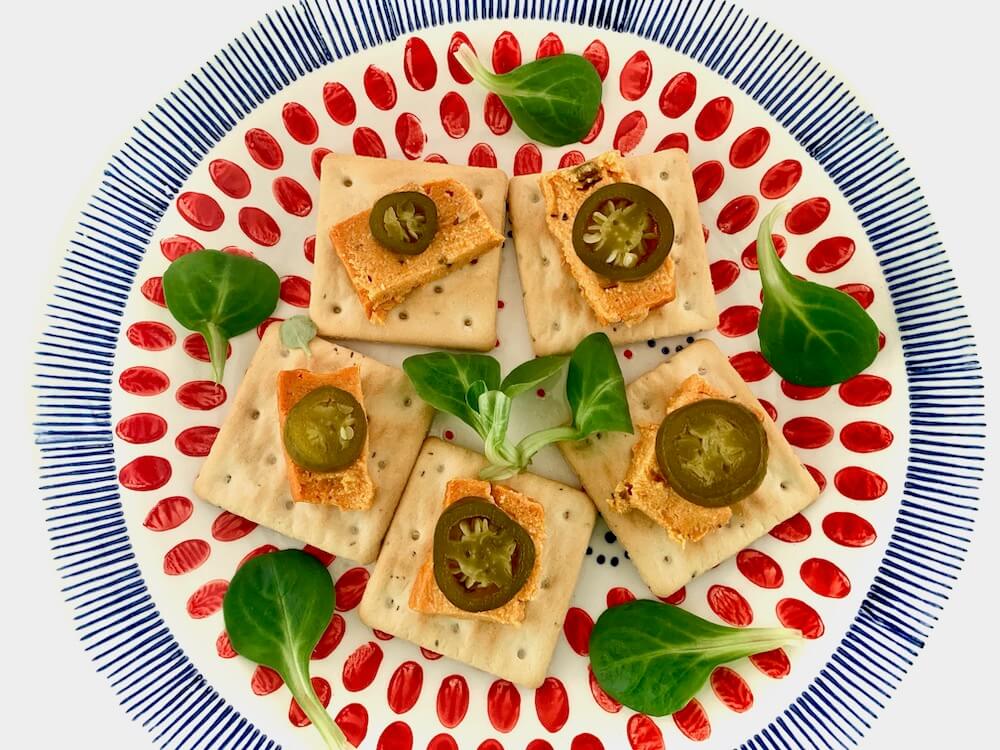 Vegan cheese with jalapeños on gluten free biscuits
