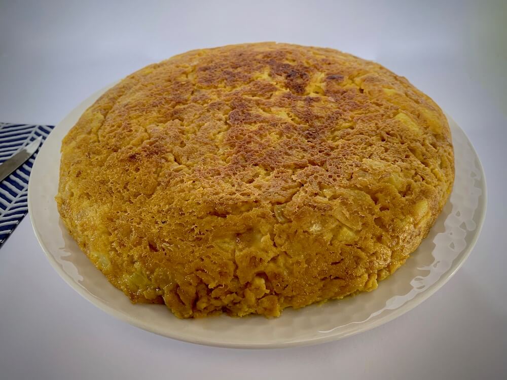 Whole vegan Spanish omelette on a plate