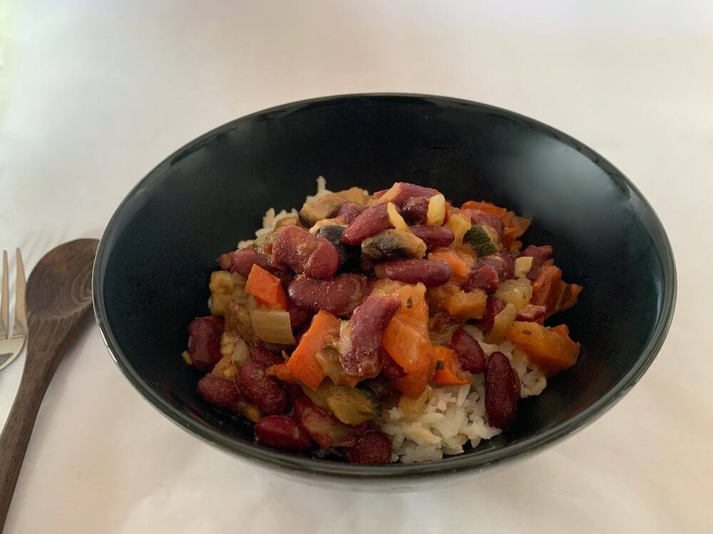 Bowl of vegan chilli beans with rice