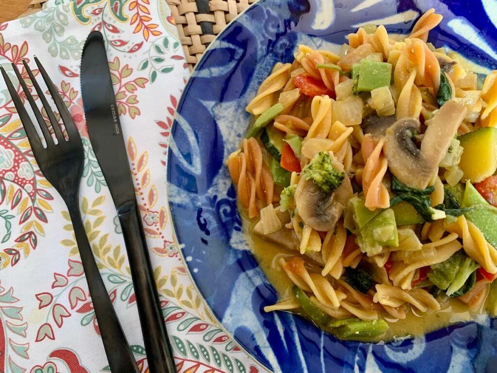 Plate of creamy vegan vegetable pasta