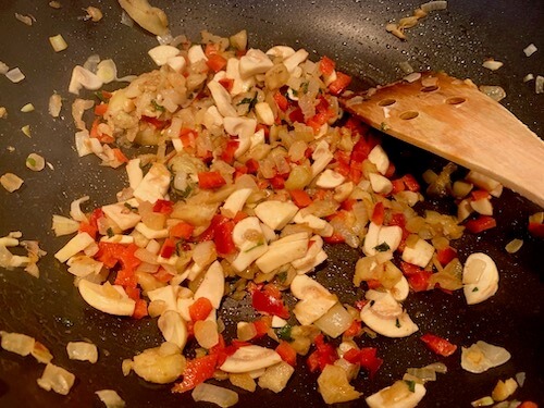 onions, eggplant, mushrooms and red pepper in a frying pan