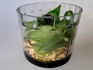 Ingredients for vegan pesto in a blender
