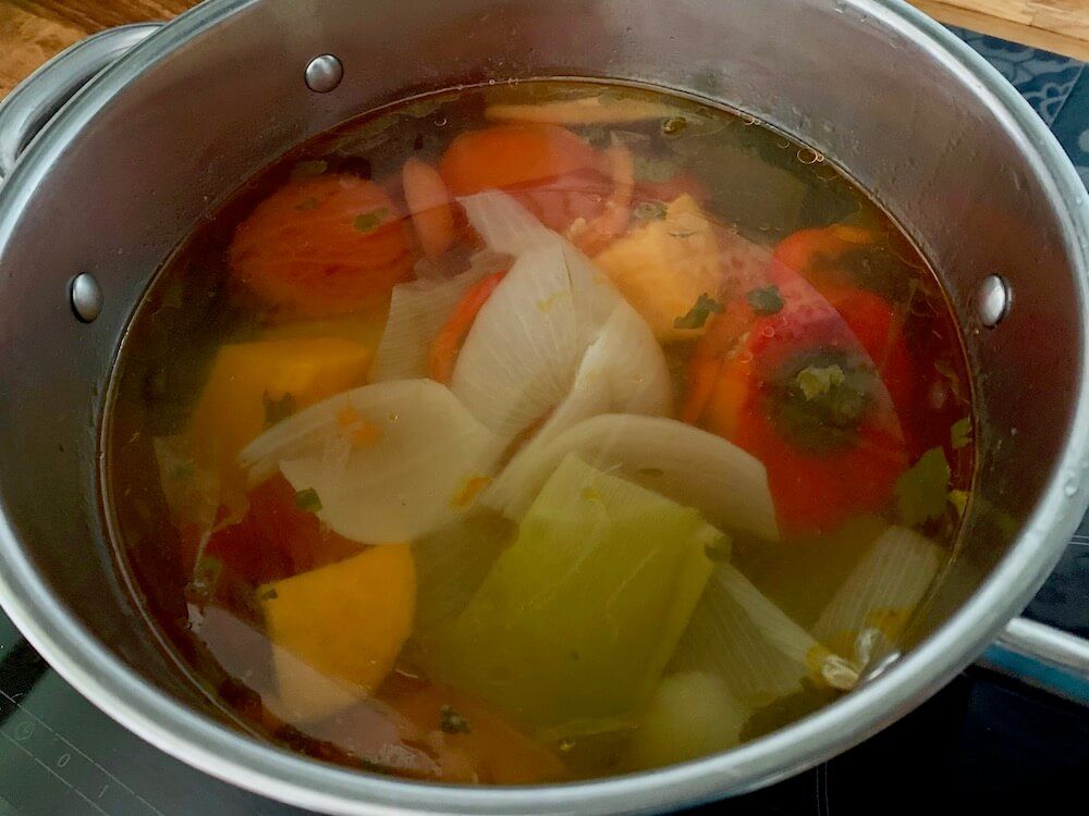 Homemade vegetable stock in a pan