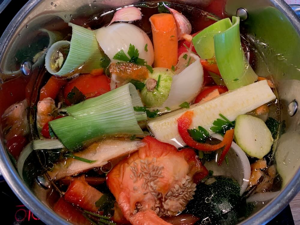Homemade vegetable stock vegetables in a pan