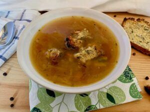 Bowl of vegan french onion soup with gluten free croutons