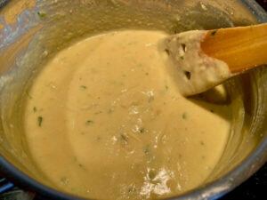 Creamy vegan cheese sauce in a pan