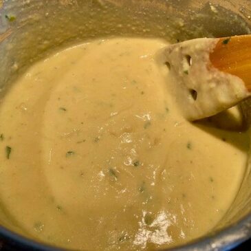 Creamy vegan cheese sauce in a pan