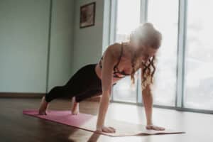 Chaturanga Dandasana yoga pose - picture of woman in plank pose