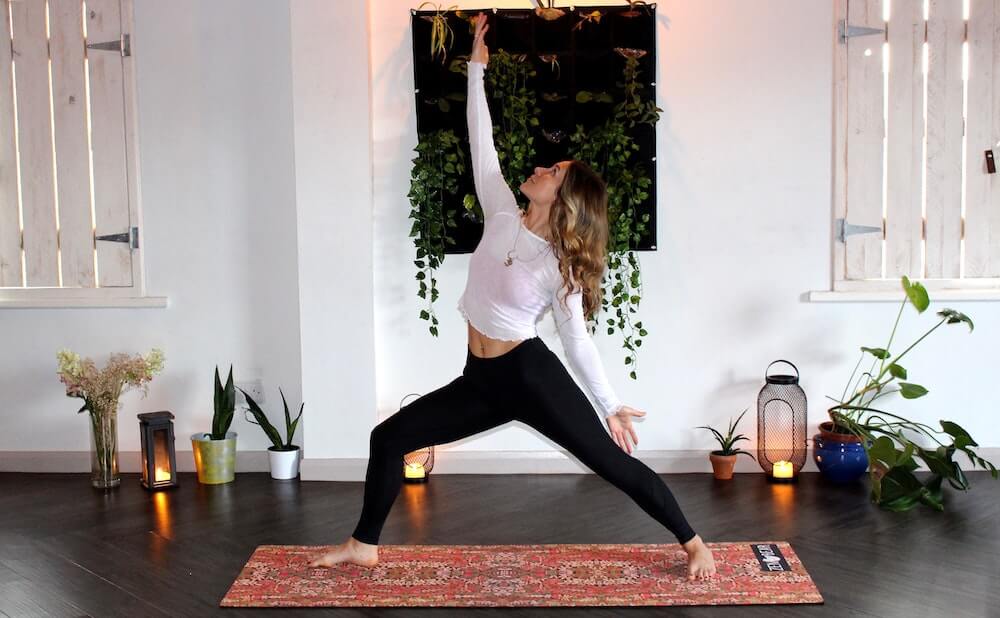 Woman doing yoga in her living room