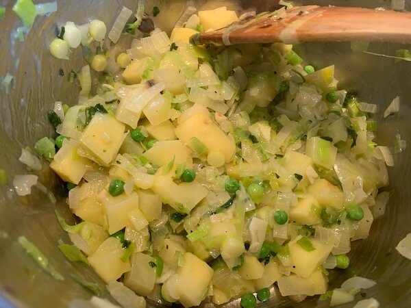 Potatoes, onion, leek and peas for potato soup
