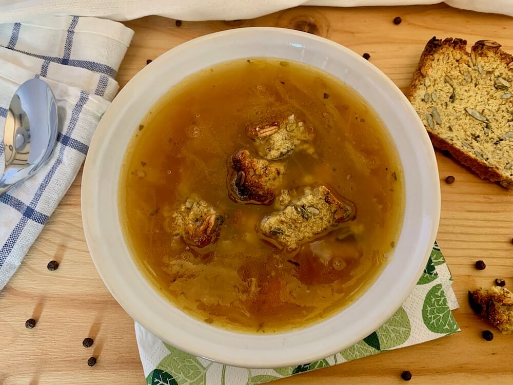 Bowl of vegan french onion soup with gluten free croutons