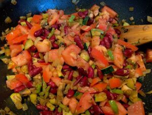 Red beans and tomatoes in tne pan for chilli-sin-carne