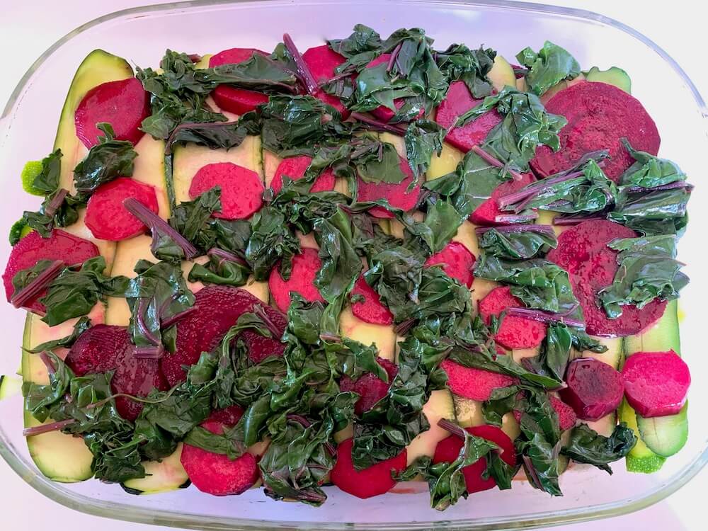 Spinach, beetroot and zucchini in a casserole dish