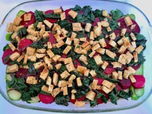 Tofu, spinach and beetroot in a casserole dish