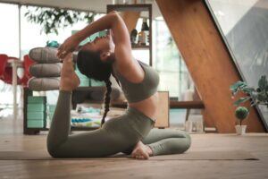 Flexible woman doing a yoga backbend