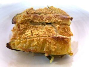 Zucchini casserole on a white background