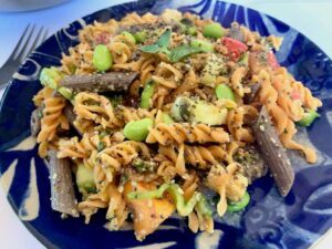Gluten free pasta salad on a blue plate