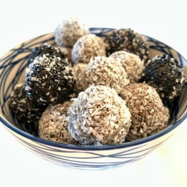 No bake protein energy balls recipe - balls rolled in coconut and black sesame seeds