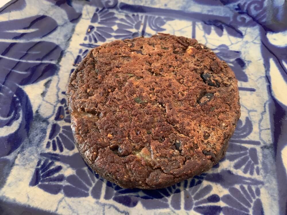 Vegan bean burger on a blue plate