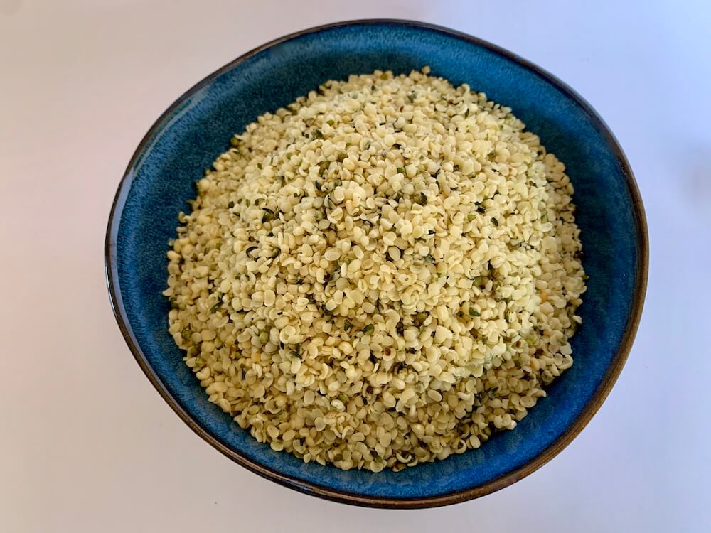 Blue bowl full of hemp seed