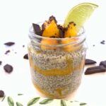 Jar of chia seed pudding with mango, dark chocolate and lime