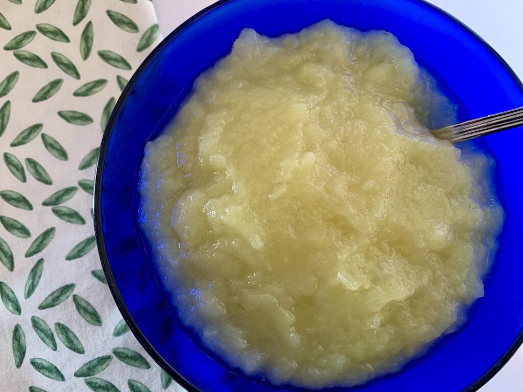 Close up of the results of this easy apple compote recipe, in a blue bowl