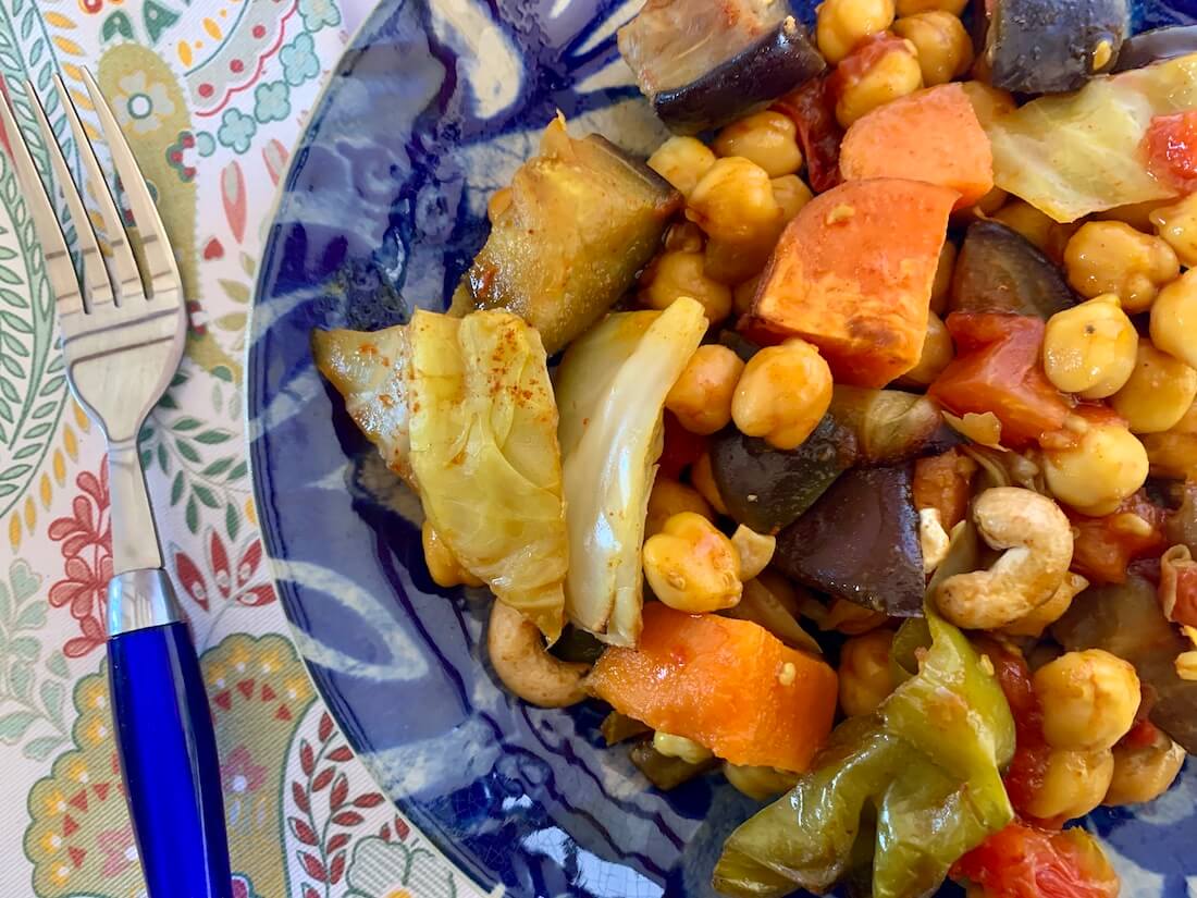 Close up of veggies and chick peas in a one pan vegan meal