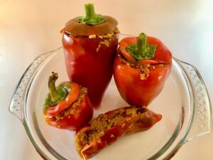 Four stuffed red peppers