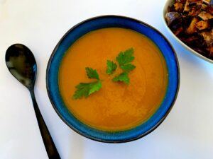 Bowl of roasted sweet potato and carrot soup