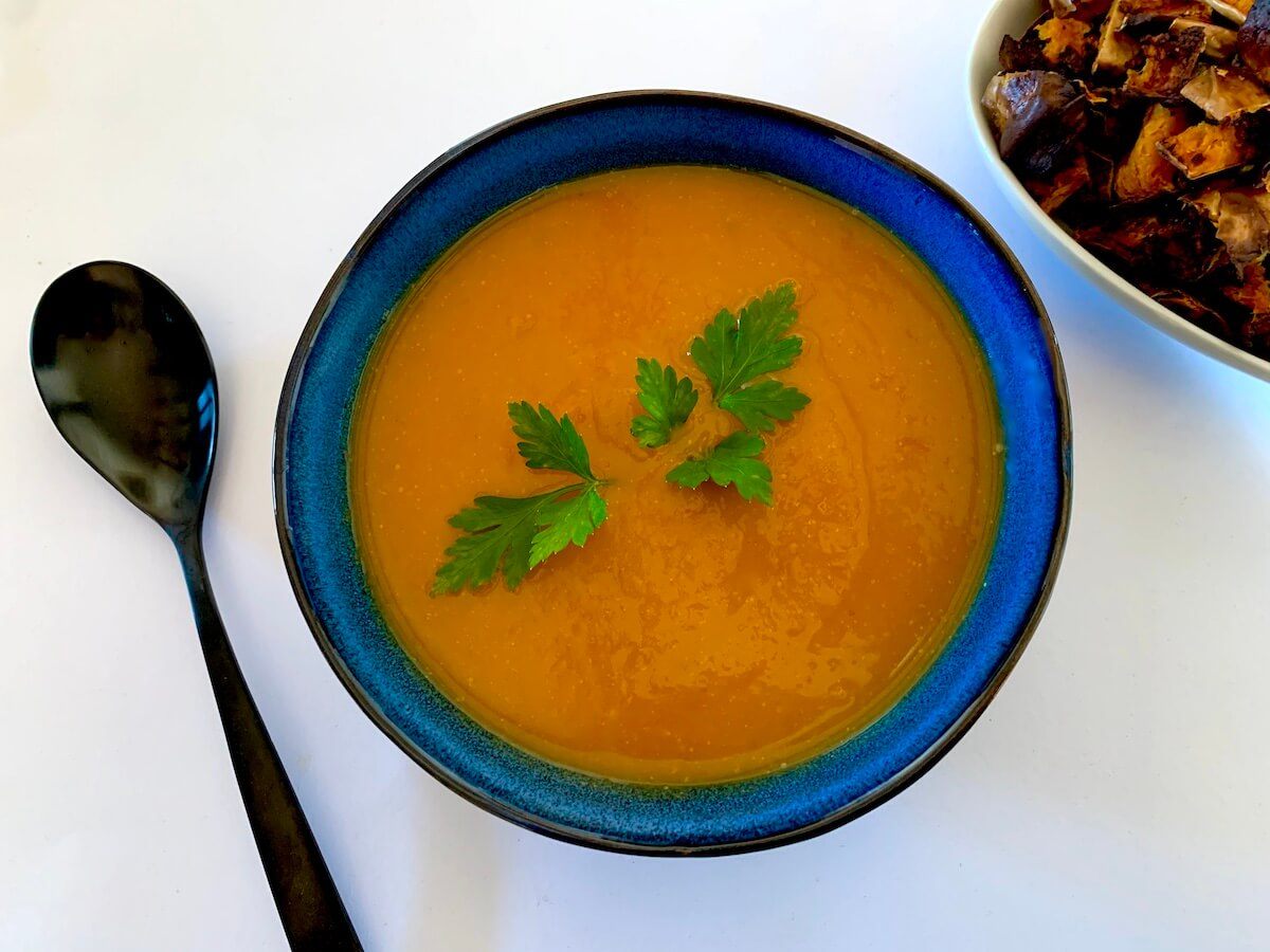 Bowl of roasted sweet potato and carrot soup