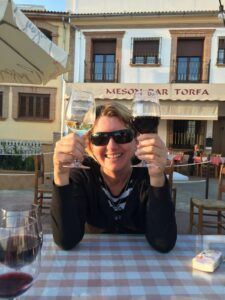 How to change your relationship with alcohol: woman holding up two glasses of wine