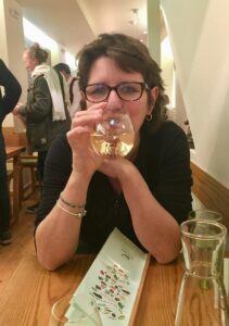 Woman drinking a glass of white wine