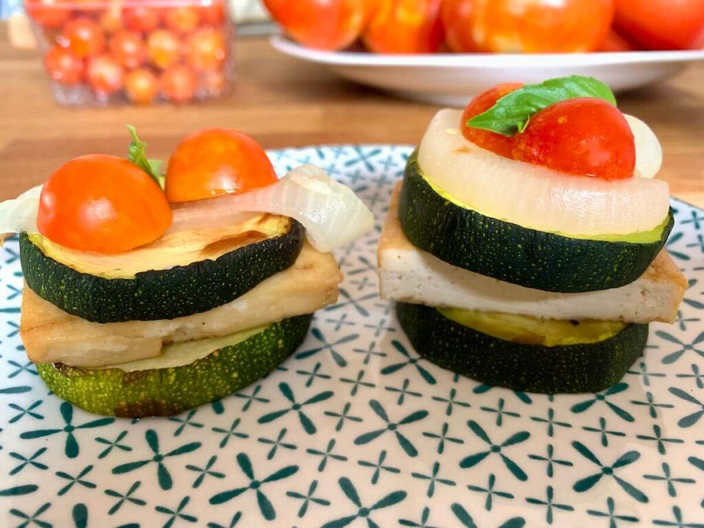 Cooking in an air fryer to make zucchini-&-tofu-tapas, shown on a plate