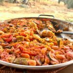 Paella on a table in the garden