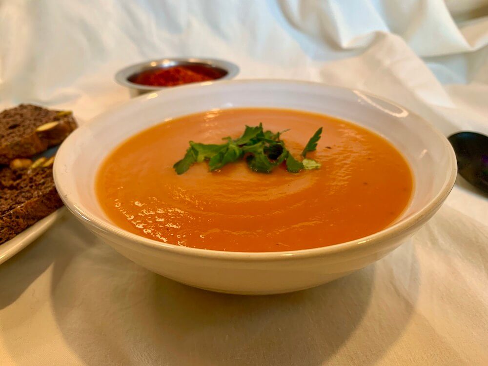 Bowl of roasted sweet potato & carrot soup