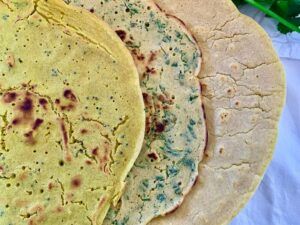 3 flavours of gram flour flatbread: cumin & turmeric; cilantro & black pepper seeds and plain