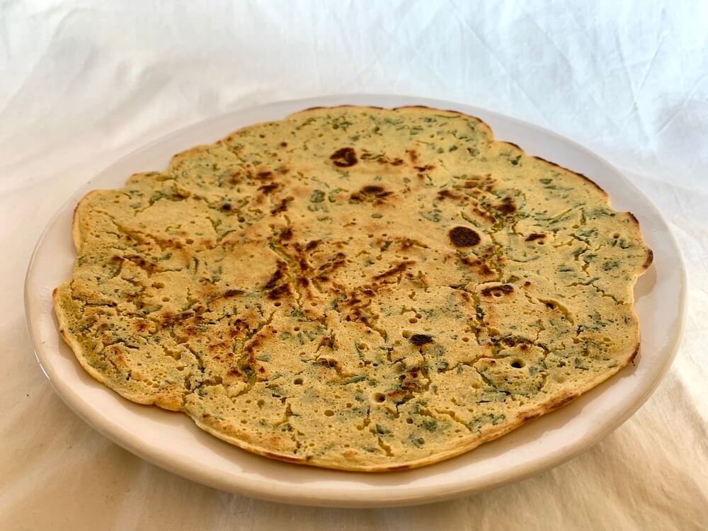 Spicy gram flour flatbread on a plate