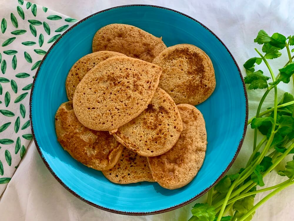 Vegan lentil flatbreads on a blue plate