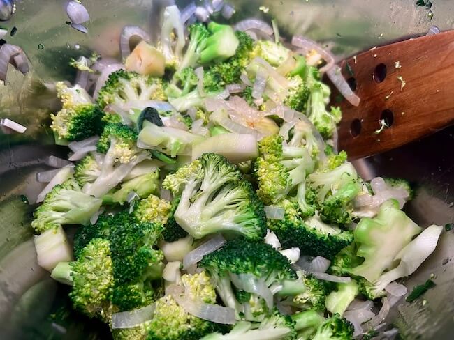 Broccoli, onion and garlic in a pan