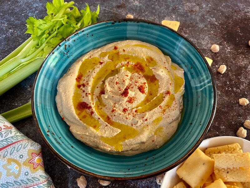 Smooth hummus with olive oil on top